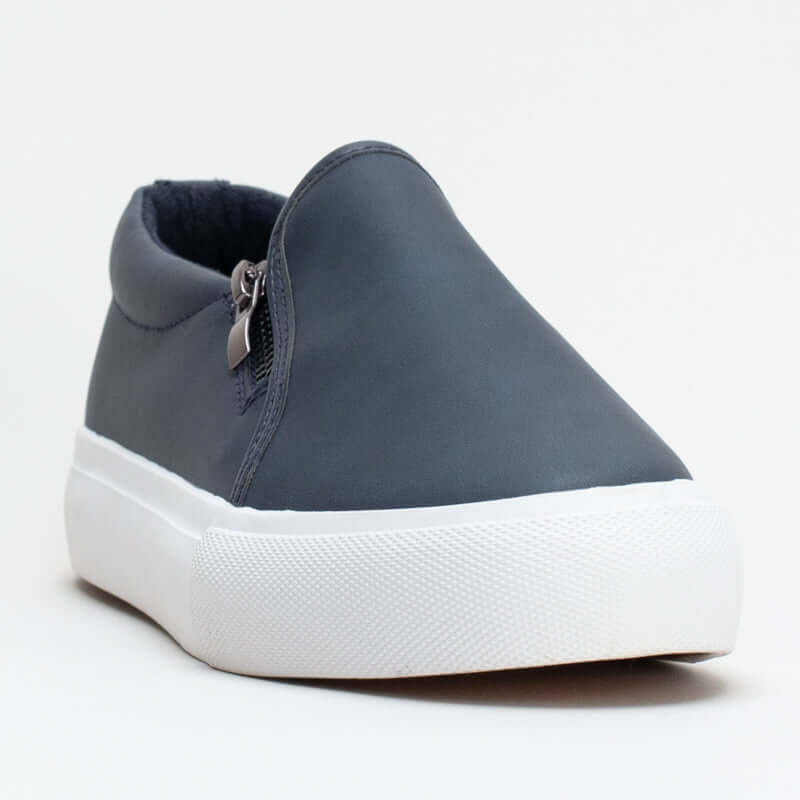 Women's Unreal slip-on sneaker in navy with synthetic upper and side zip detail for easy wear and stylish comfort.